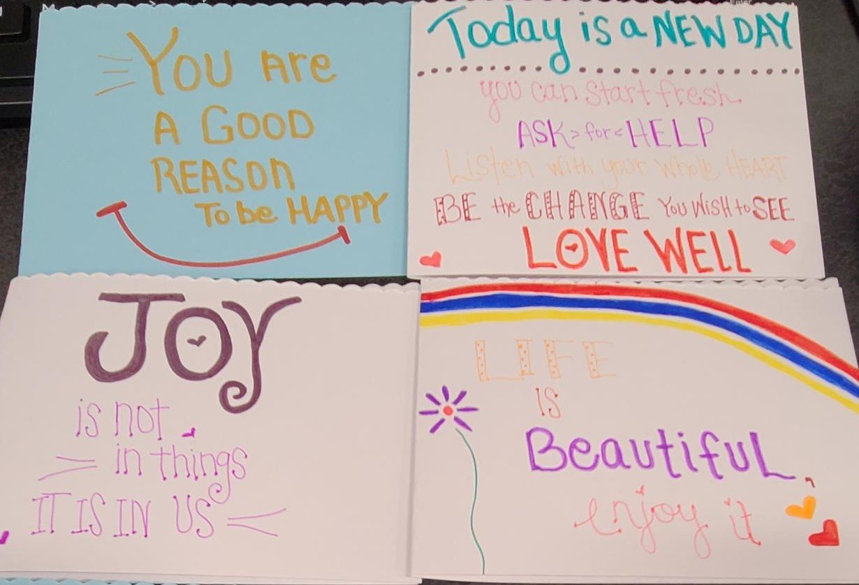 Four homemade cards are pictured side by side.