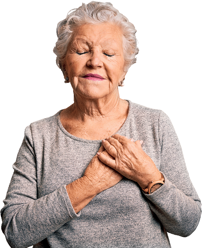 header-grateful-senior Well-dressed senior woman with eyes closed, a slight smile, and hands clasped over her heart.